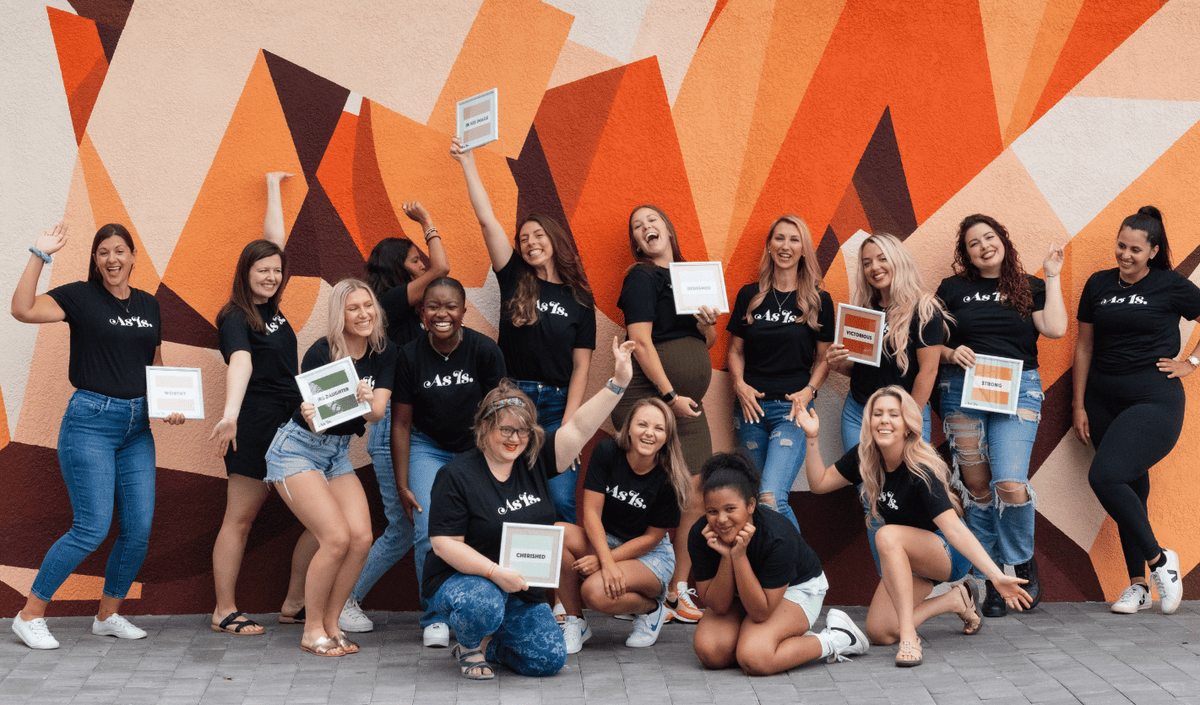 Large group of women posing together, empowerment event and community gathering