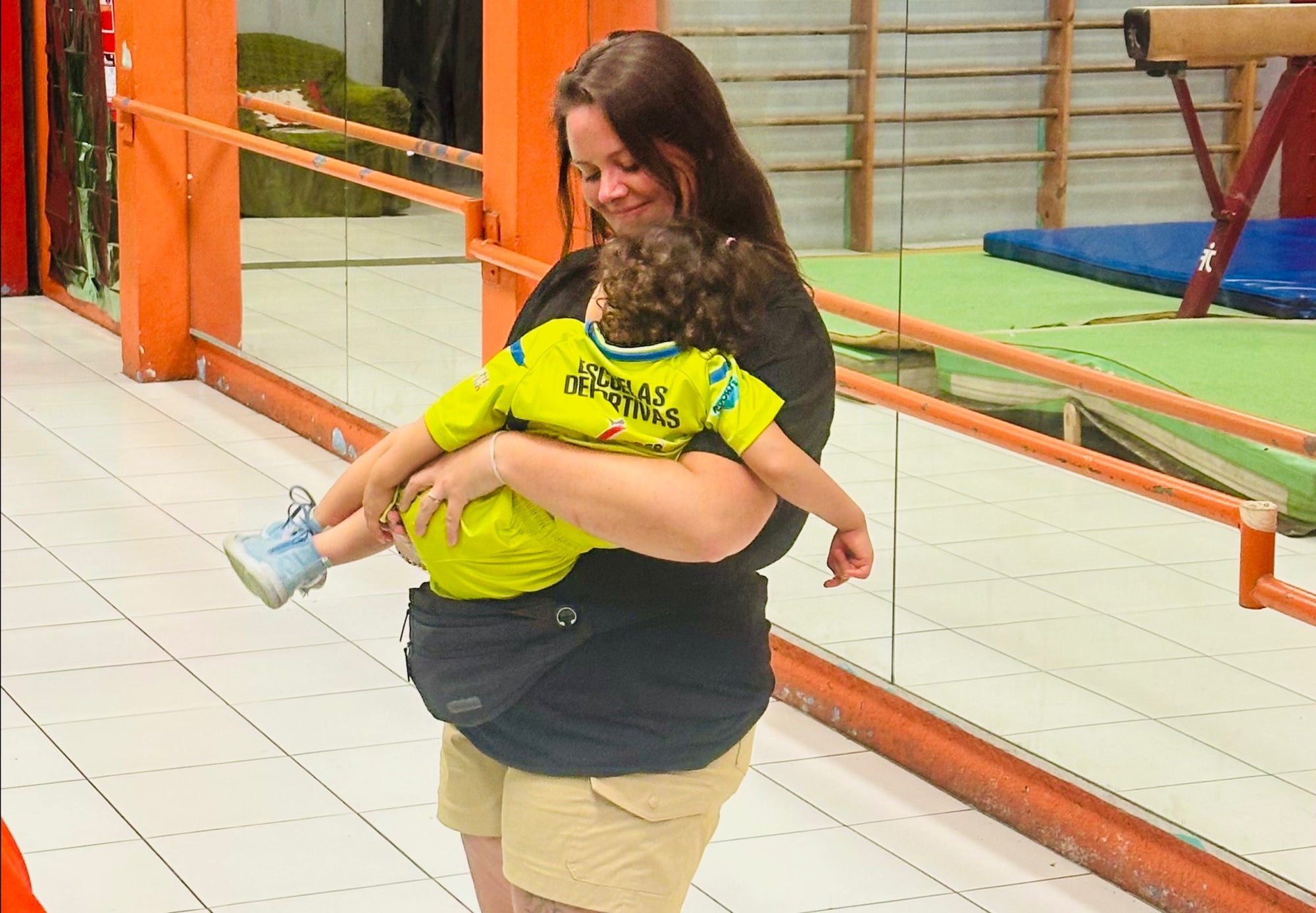 Woman holding and hugging child in caring moment, emotional support and connection